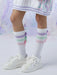 Girl modelling the A Dee noola knee socks.