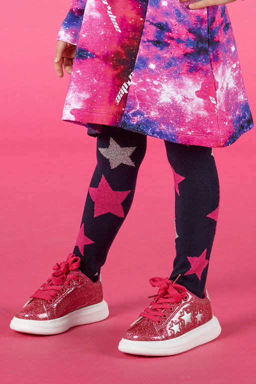 Girl modelling the A Dee Queeny Glitter Trainers.