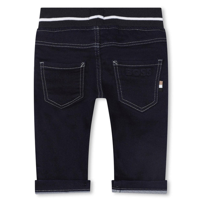 Rear view of the BOSS pull up jeans.