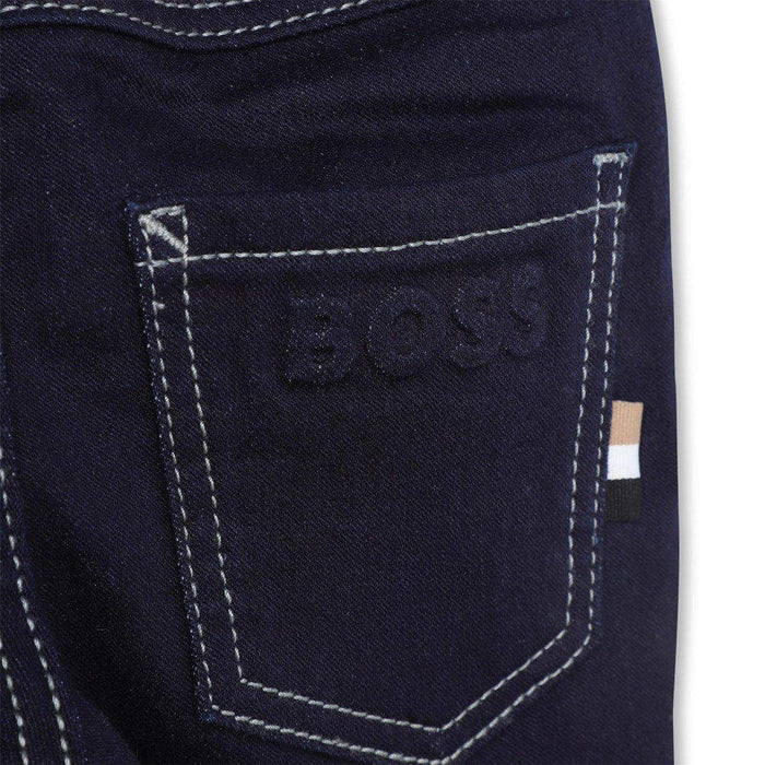 Closer look at the BOSS black pull up jeans.
