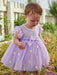 Baby girl modelling the Caramelo daisy tulle dress.