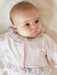 Baby  wearing the Deolinda gardenia babygrow.