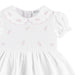 Closer look at the Deolinda white smocked dress.