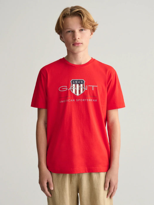 Boy modelling the GANT archive shield t-shirt.