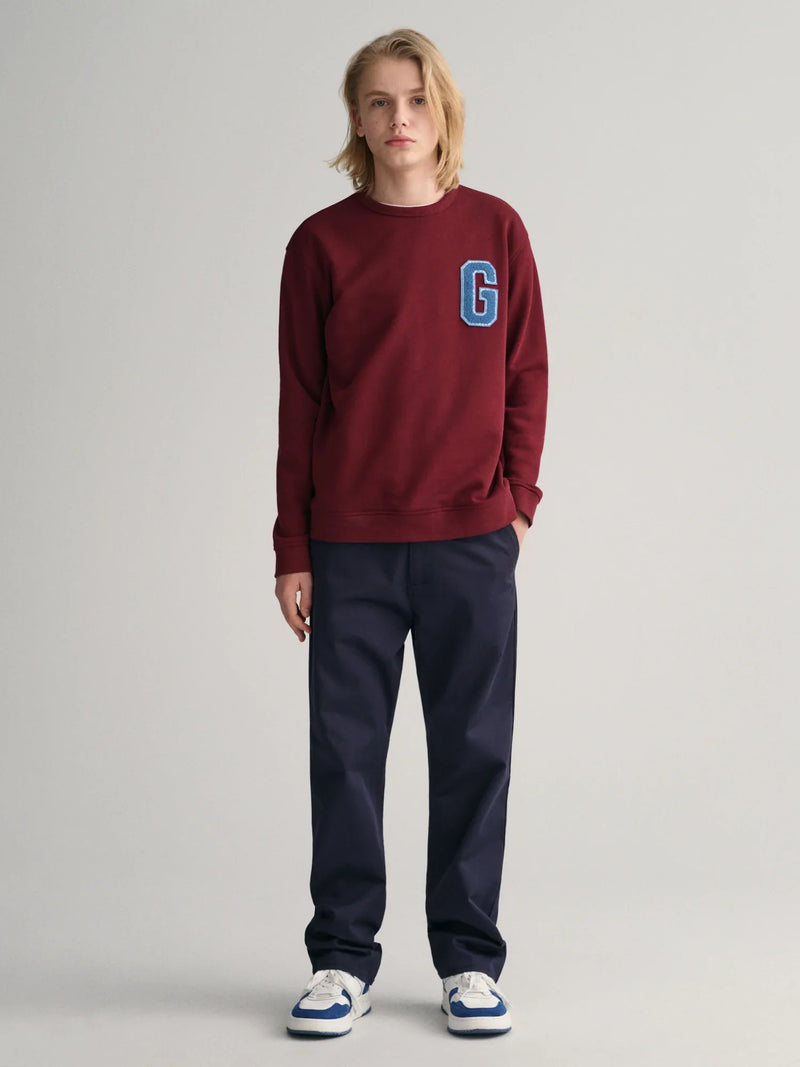 Boy modelling the GANT chinos.