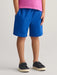 Boy wearing the GANT shield track shorts.