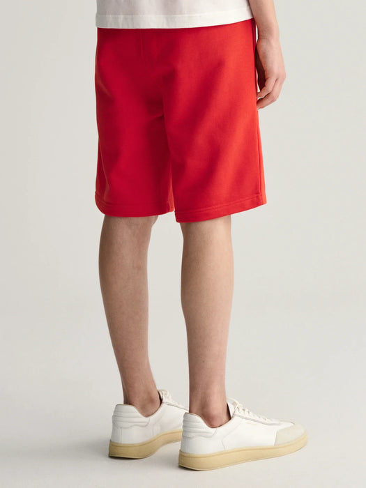 Back of the GANT red shield track shorts.