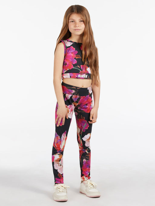 Girl modelling the Guess floral print leggings and matching crop top..