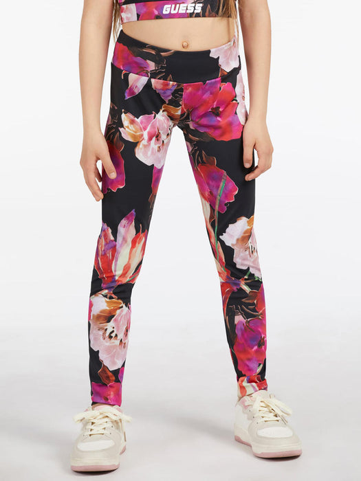 Girl modelling the Guess floral print leggings.
