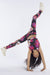 Girl wearing Guess girl's printed leggings while doing a handstand.