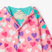 Closer view of the Hatley colourful hearts colour changing raincoat.