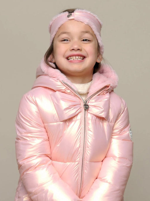 Smiling girl modelling the Le Chic babely puffer jacket.