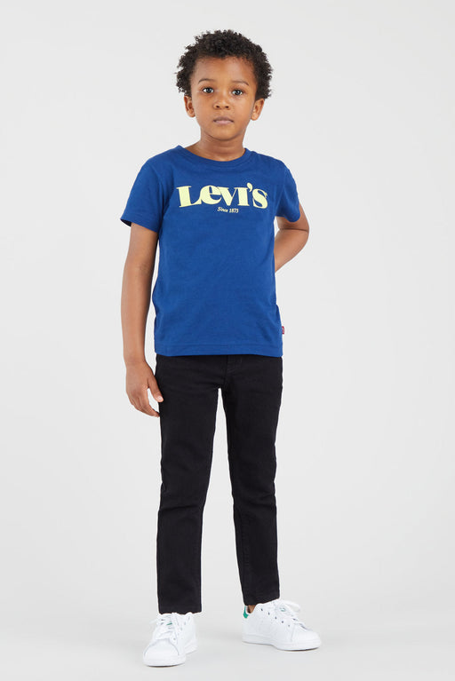 Boy modelling the black Levi's 510 skinny fit jeans.
