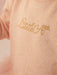 Baby girl's tunic with gold rhinestone logo. 