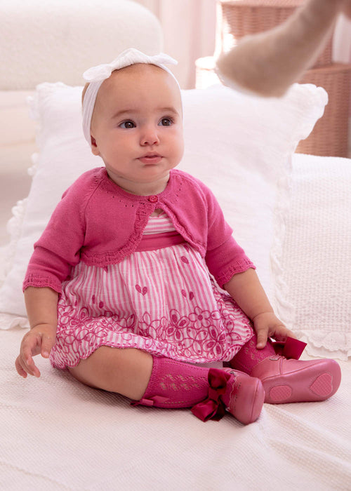 Baby girl wearing the Mayoral dark pink bow stockings.