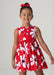 Smiling girl modelling the Mayoral daisy print dress.