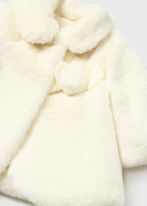 Closer look at the Mayoral cream faux fur coat.