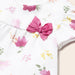 Mayoral white top with dark pink floral pattern.