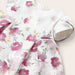 Mayoral white dress with dark pink floral print.