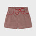 Girl's red houndstooth shorts.
