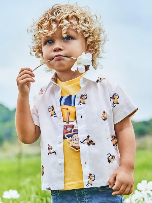 Baby boy wearing the Mayoral monkey print shirt.