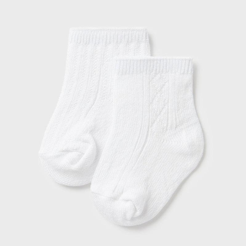 Closer view of the Mayoral patterned socks.