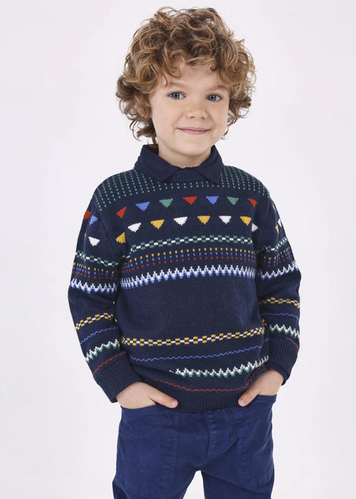 Smiling boy modelling the Mayoral patterned sweater.