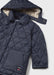 Closer view of the Mayoral quilted jacket.