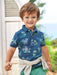Baby boy wearing the Mayoral safari print polo shirt.
