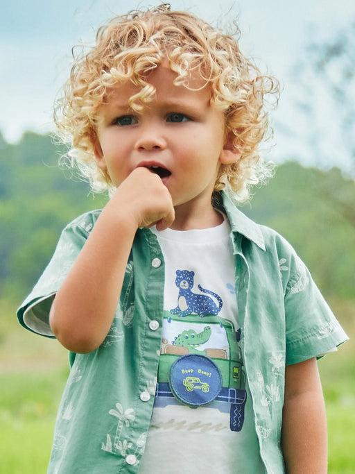 Baby boy modelling the Mayoral safari t-shirt.