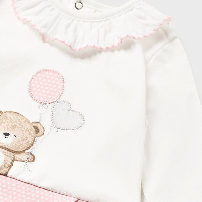 Baby girl's white top with cute teddy bear appliqué.