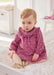 Baby girl wearing the Mayoral velvet dress.