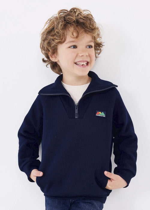 Smiling boy modelling the Mayoral 3/4 zip sweatshirt.