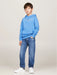Boy wearing the Tommy Hilfiger essential hoodie.