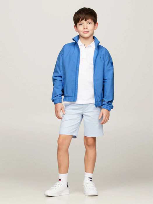 Boy modelling the Tommy Hilfiger essential jacket.
