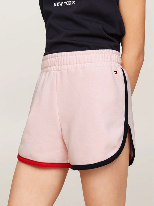 Girl wearing the Tommy Hilfiger global stripe track shorts.