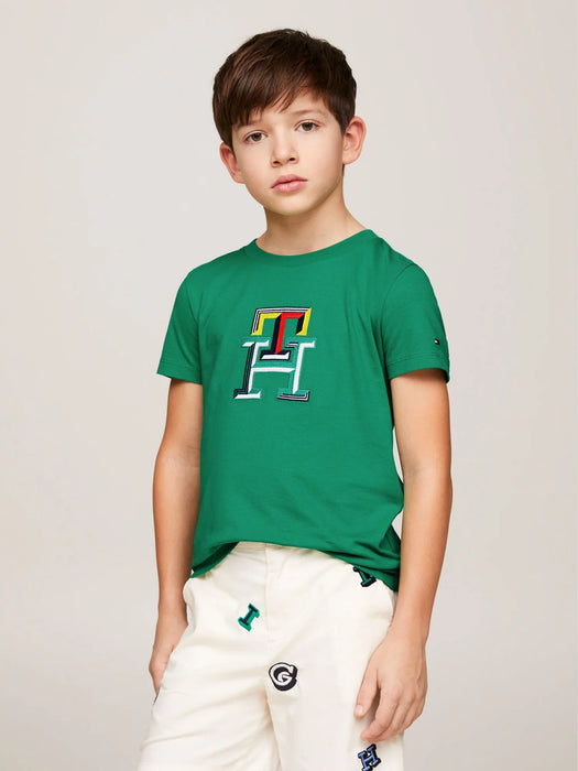 Boy modelling the Tommy Hilfiger monogram t-shirt.