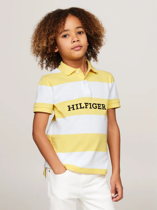 Boy wearing the Tommy Hilfiger striped polo shirt.